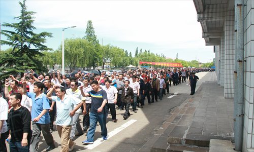 Chinese workers demonstrate and srtike at Apollo - Cooper Tires merger deal